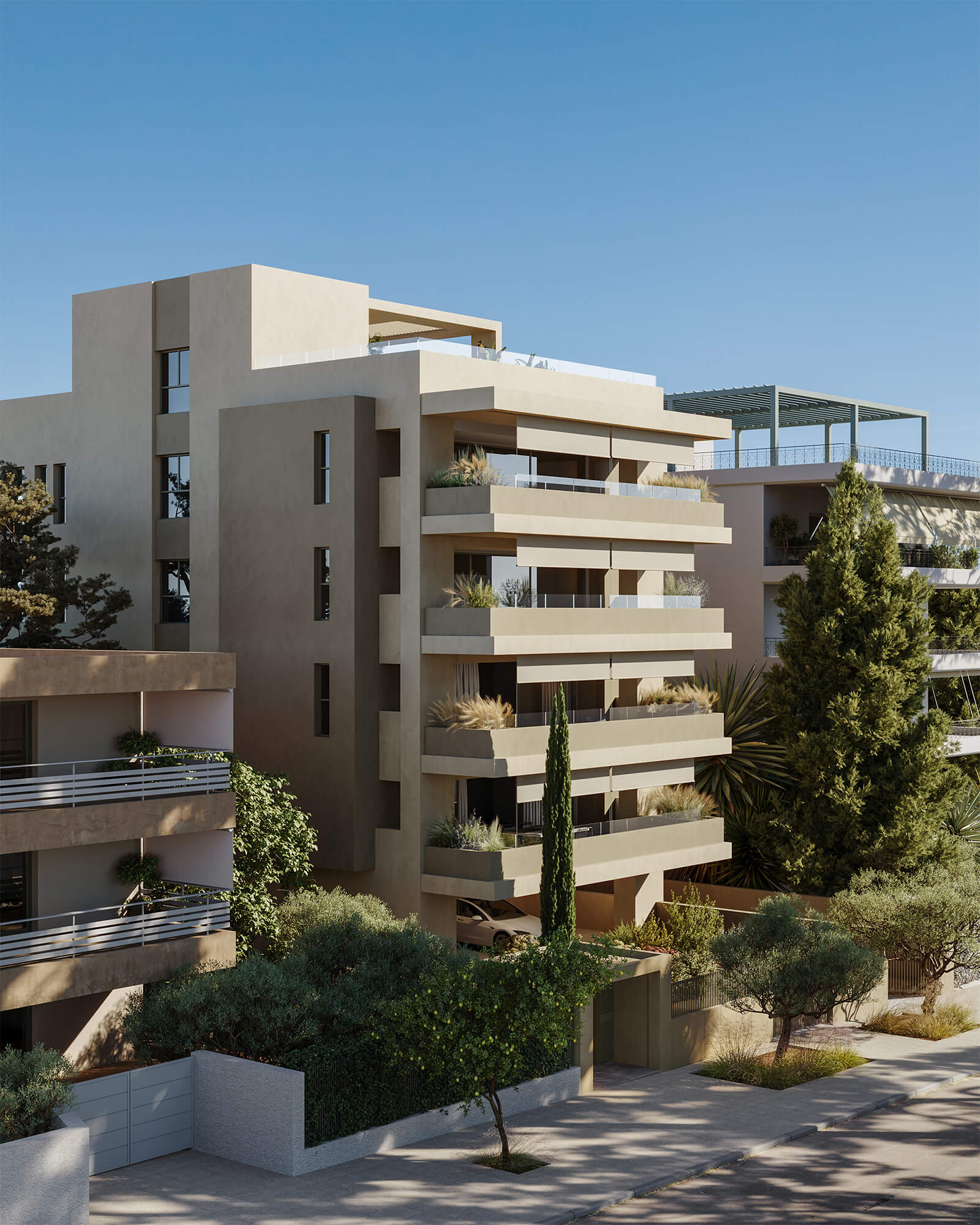 Hatsios Development-Corner street view of a new residential building in Voula with stacked terraces, planted balconies and a slender cypress at the entrance.-Afroditis46