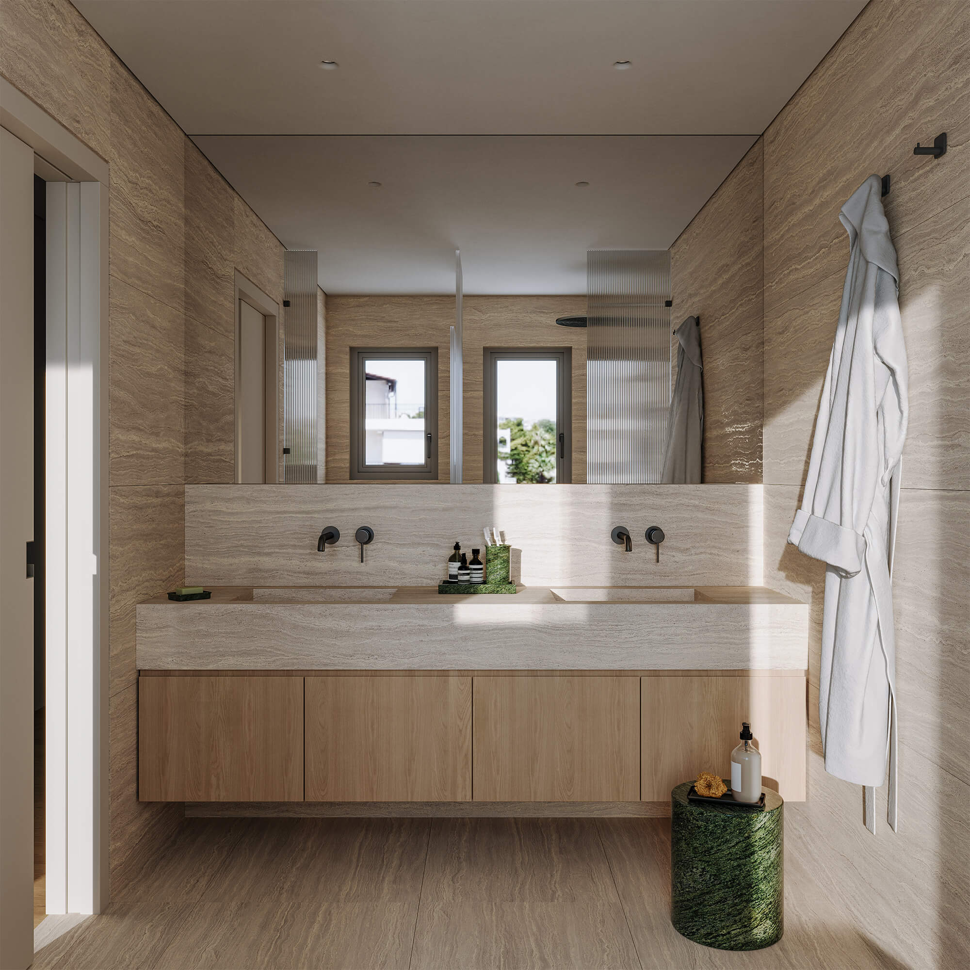 Hatsios Development-Travertine-clad master bathroom with a double-sink stone vanity, wall-mounted black taps and an oak cabinet below.-Afroditis46