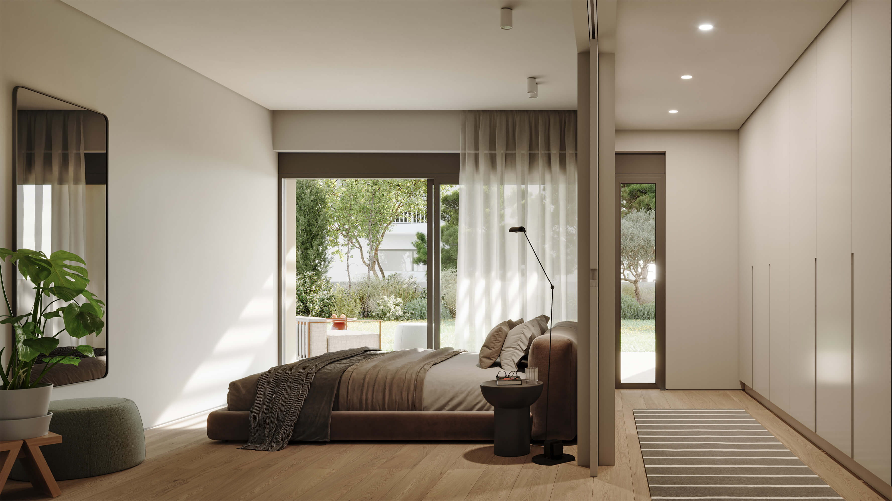 Hatsios Development-Bedroom with garden views through sliding doors and a full-height built-in wardrobe along one wall.-Afroditis46